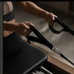 Reformer strap tension grip